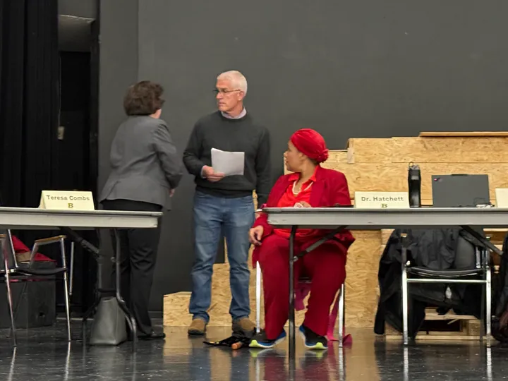 Hatchett's expenses not at issue, teacher contracts are